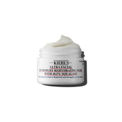 Kiehl's Ultra Facial Overnight Mask bottle closeup for hydration and barrier support.