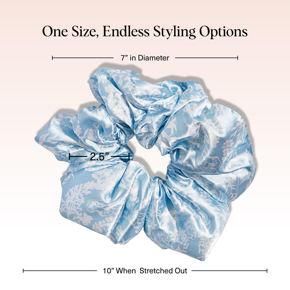 Kitsch Bridgerton satin scrunchies worn on the wrist add chic style without snagging hair.