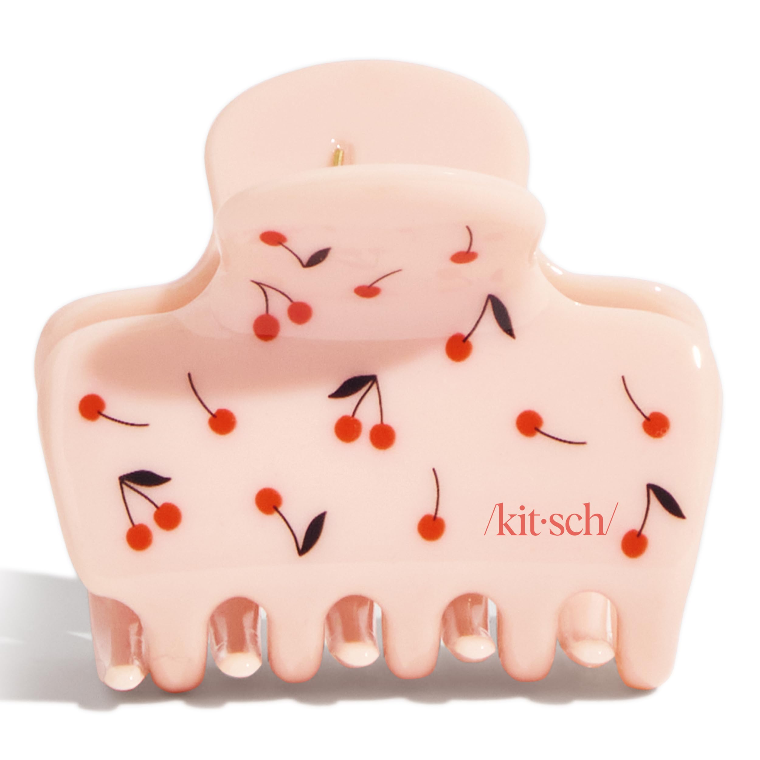 Kitsch cherry print clip worn with ponytail illustrates strong hold