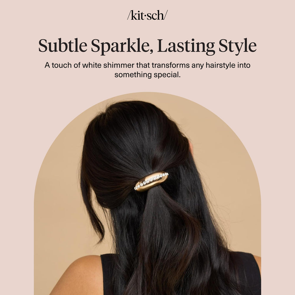 Kitsch luxury gold hair cuff with shimmering finish complements evening looks.