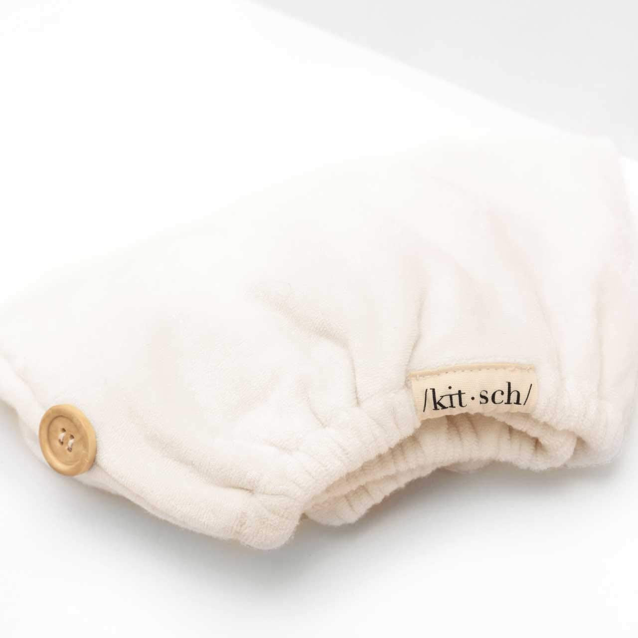 Kitsch white ivory hair towel wrap in bathroom setting.