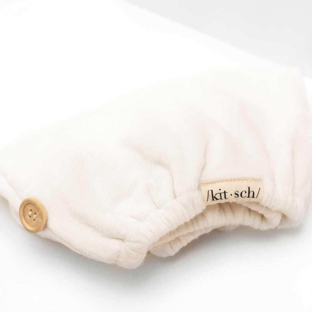 Kitsch white ivory hair towel wrap in bathroom setting.