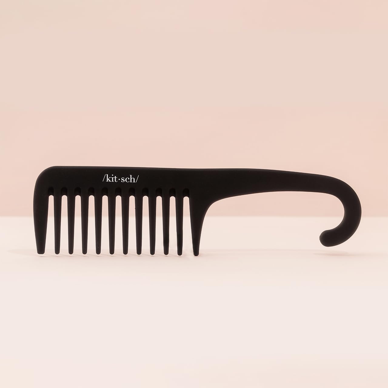 Kitsch wide-tooth detangler travel-compact fits bags for on-the-go styling.