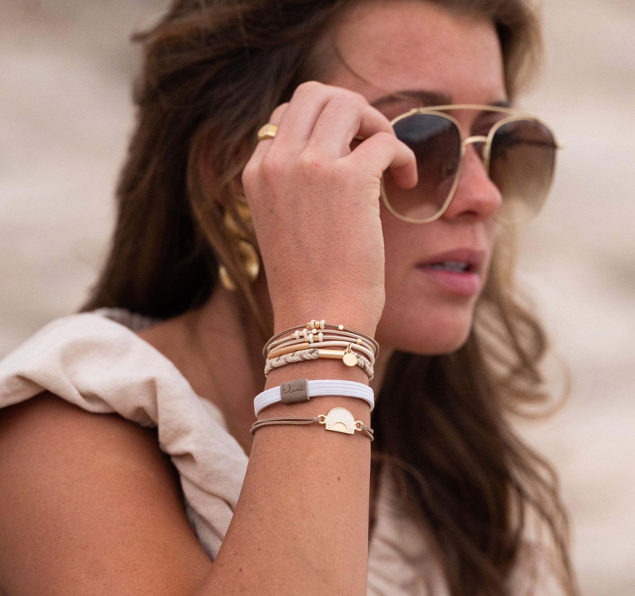 K'lani Rise mindset-themed design adds daily motivation to style.
