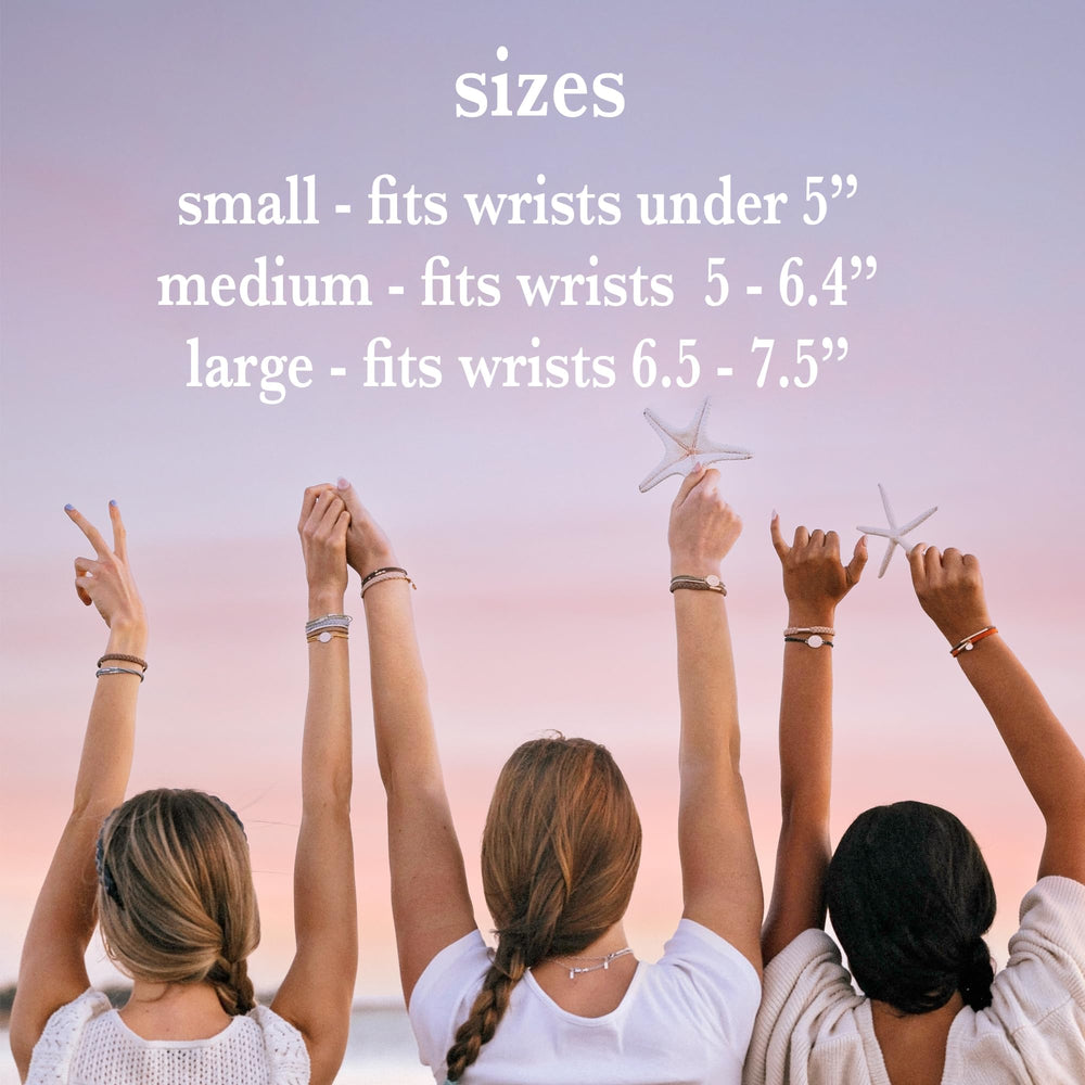 K'lani Rise stackable bracelets on wrist for layered, boho-inspired looks.