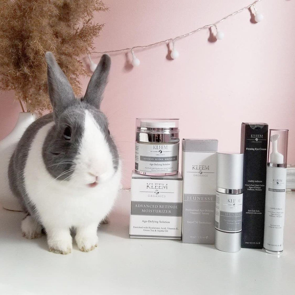 Kleem Organics serum pictured beside sunscreen and moisturizer for daily care