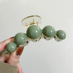 KOLONAMS Large Green Pearl Hair Claw demonstrates secure hold for all hair types