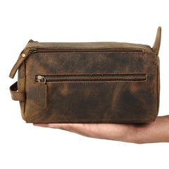 KomalC water-resistant lining keeps grooming essentials dry during travel.