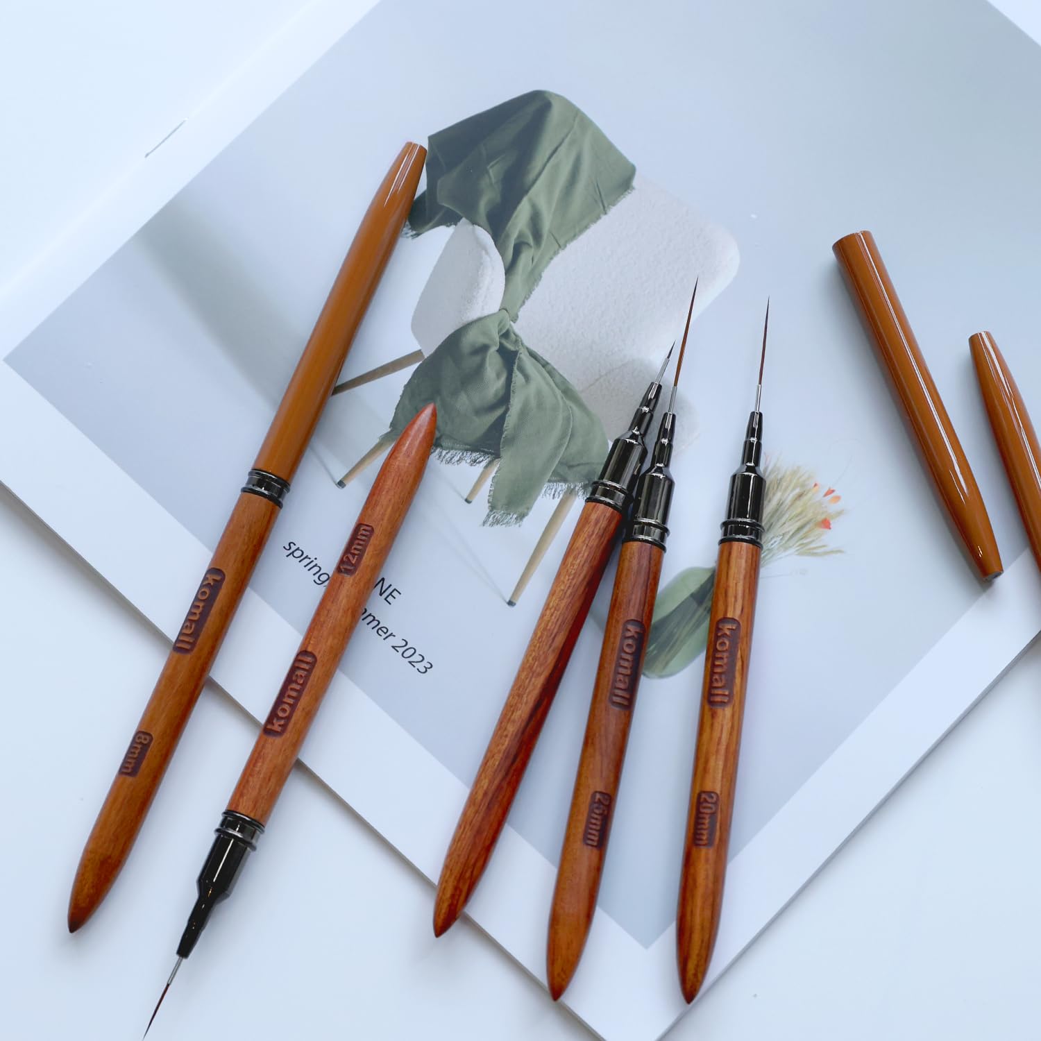 Komall nail art brush set for versatile home or salon use.