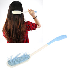 KooingTech long handle brush performing scalp massage during detangling.