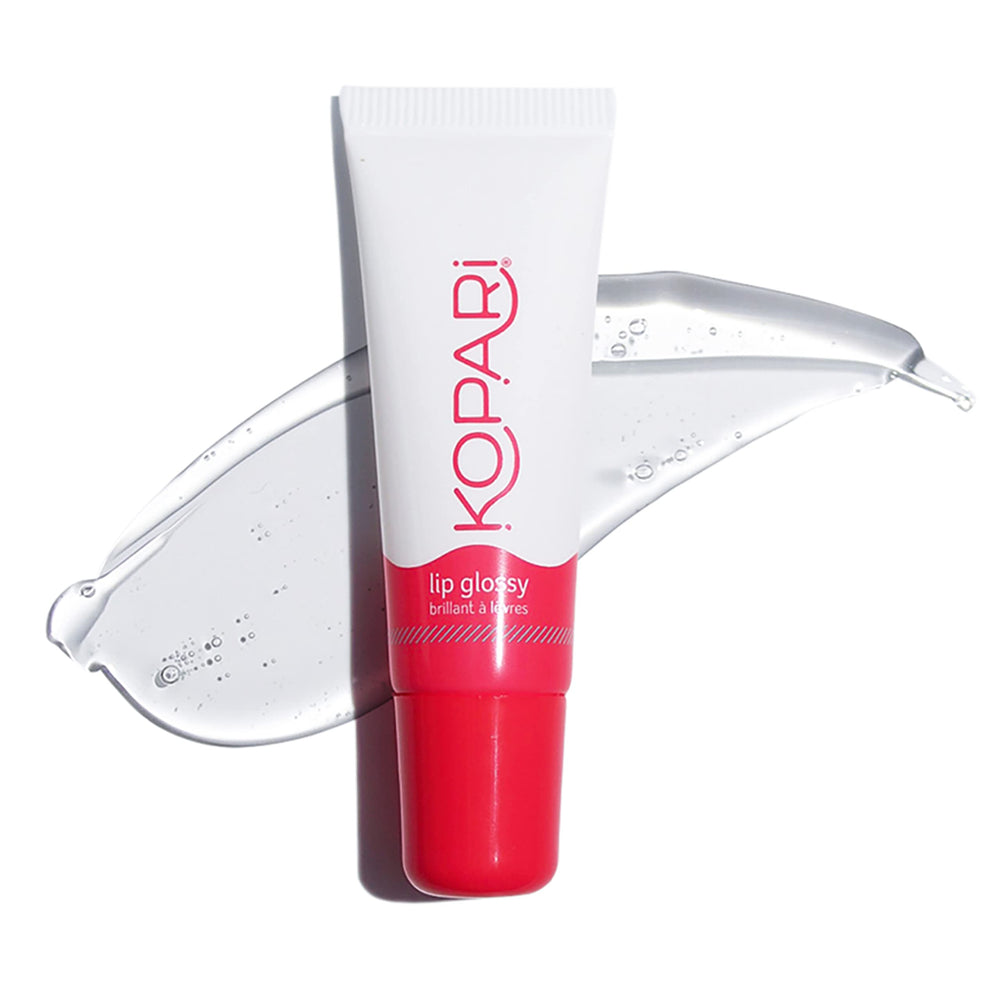 Kopari Coconut Lip Glossy clear bottle shows hydrating lip care.
