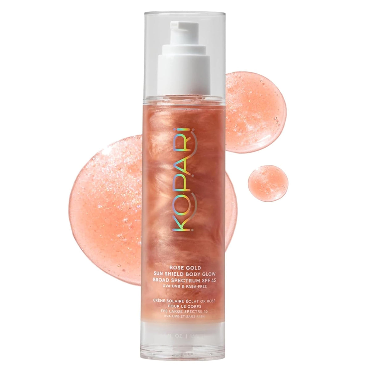 Kopari Sun Shield Body Glow bottle shimmering with rose-gold radiance.