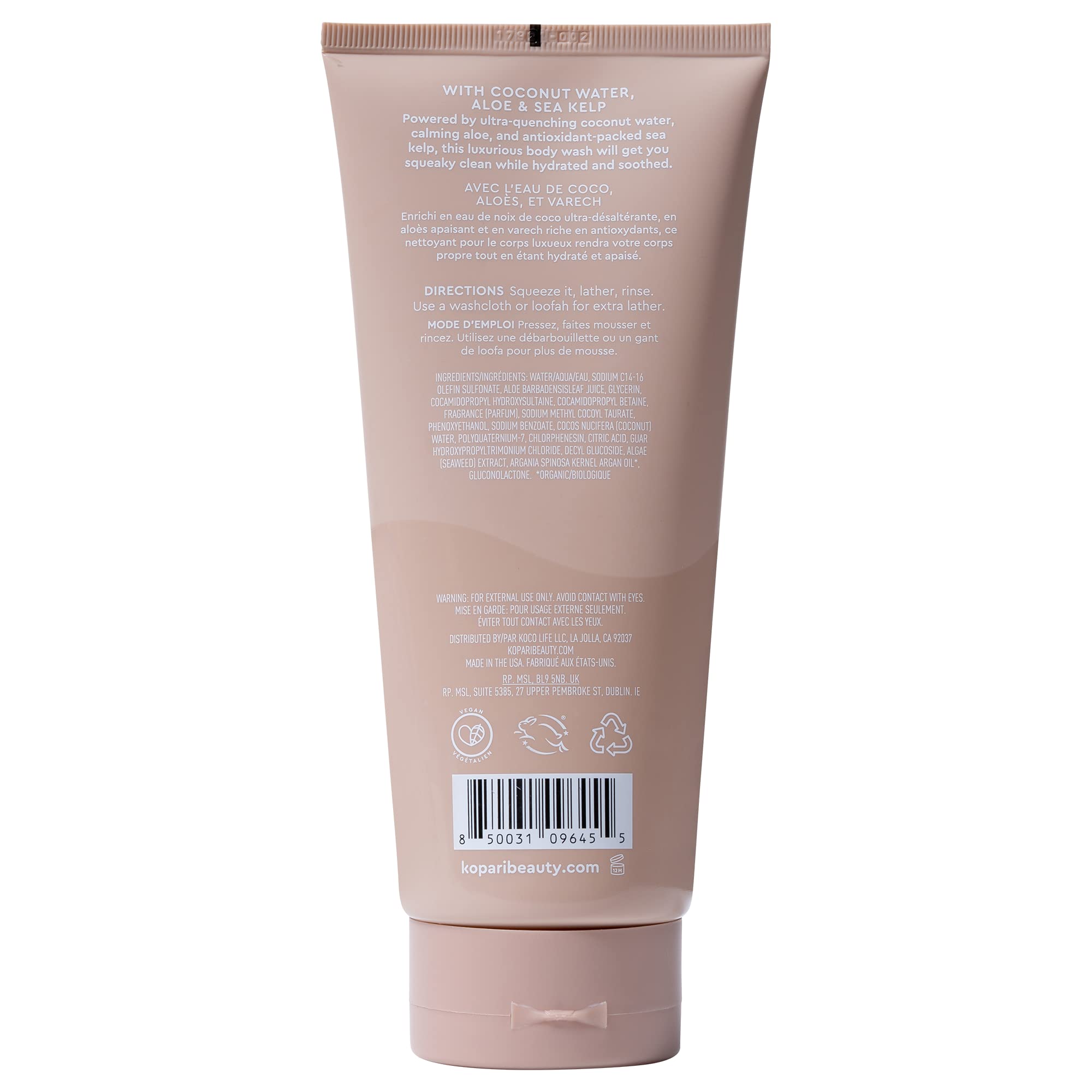 Kopari Tahitian Vanilla bottle on a shower shelf signaling vegan, cruelty-free cleanse.