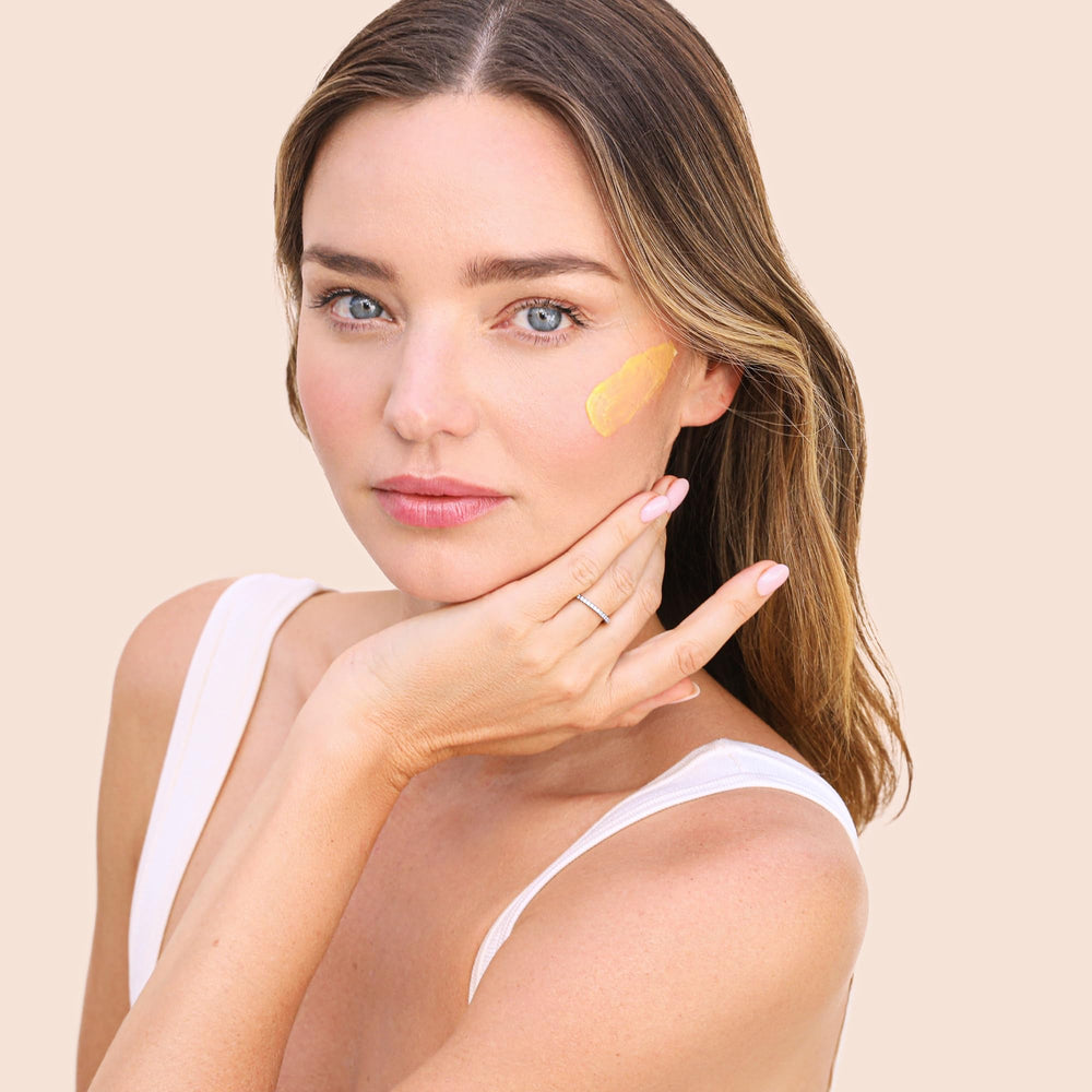 KORA Organics Turmeric Glow Moisturizer cream texture showing smooth consistency for skin