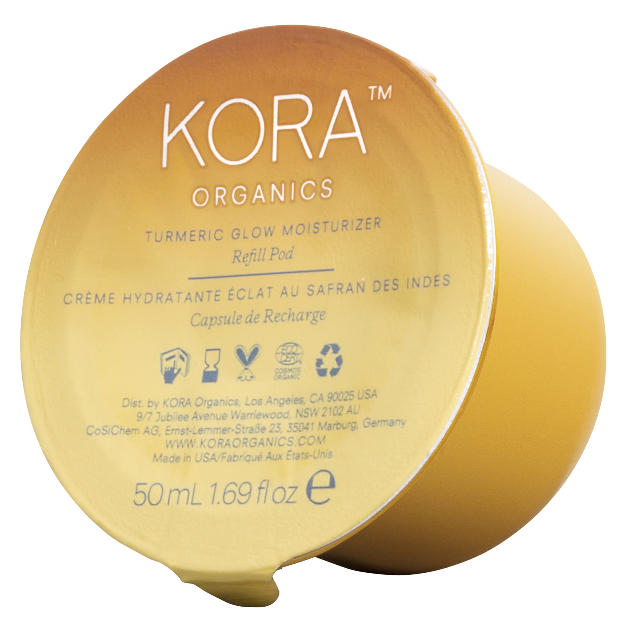 KORA Organics Turmeric Glow Moisturizer refill pod close-up for sustainable packaging promoting hydration