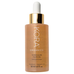 KORA Organics Noni Glow oil bottle closeup for radiant, hydrating skin care