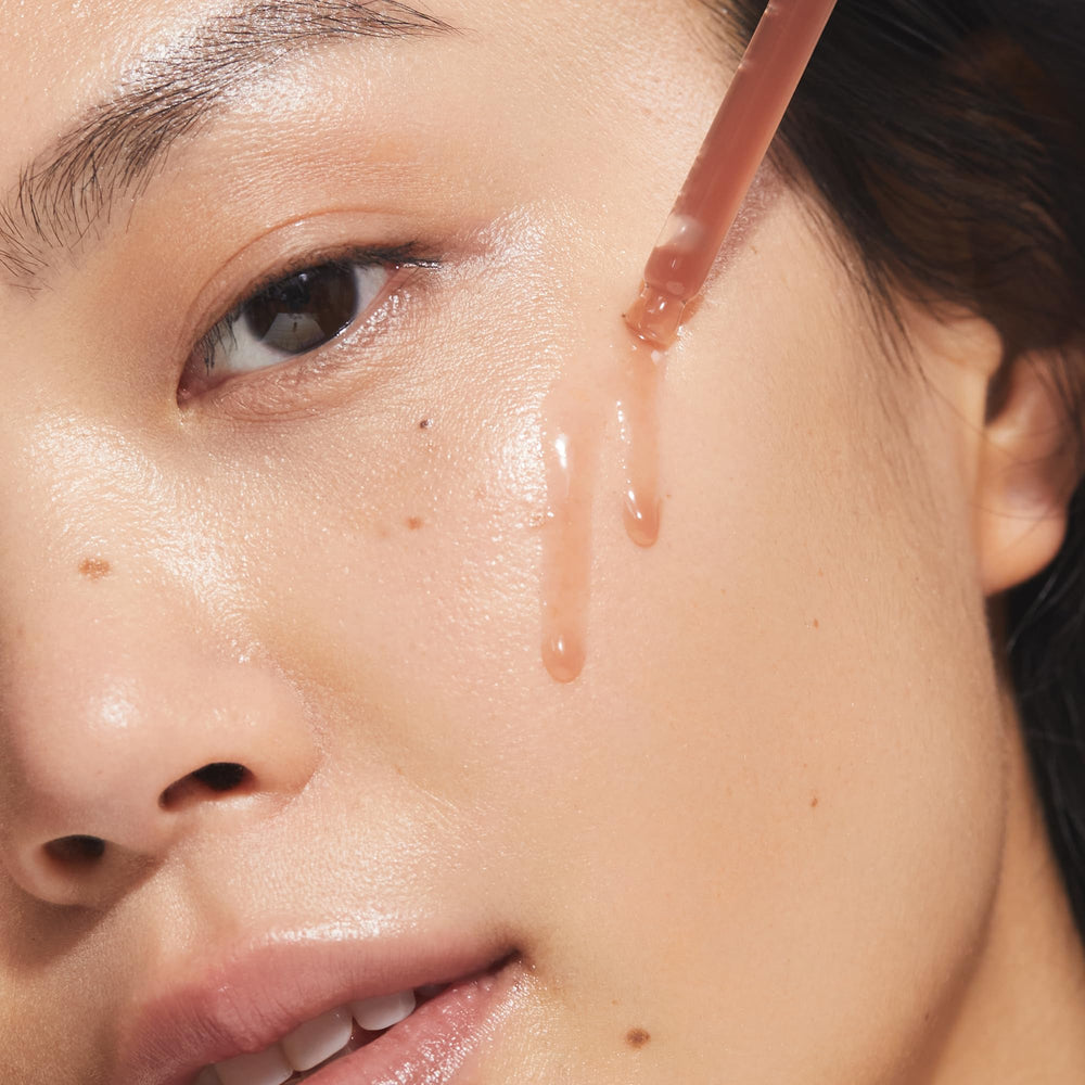 KORA Organics Turmeric Glow Drops dropper closeup for precise, refined texture application.