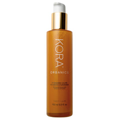 KORA Organics Turmeric Glow Foaming Cleanser foam closeup shows rich lather for a deeper cleanse.