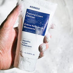 KORRES Greek Yoghurt Foaming Cream Cleanser applied to the face for makeup removal and refreshing cleanse.