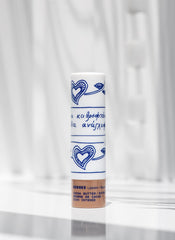KORRES Lip Butter Stick applied on lips showing subtle tint.
