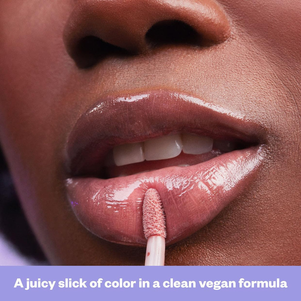 Kosas Wet Lip Oil Gloss layered over lipstick demonstrates extended color and glaze.