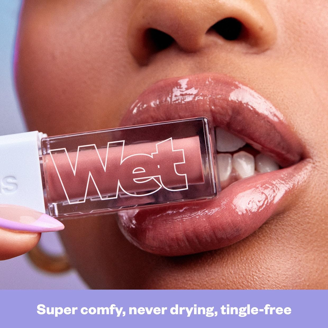 Kosas Wet Lip Oil Gloss on lips showcases plush shine and soft texture.