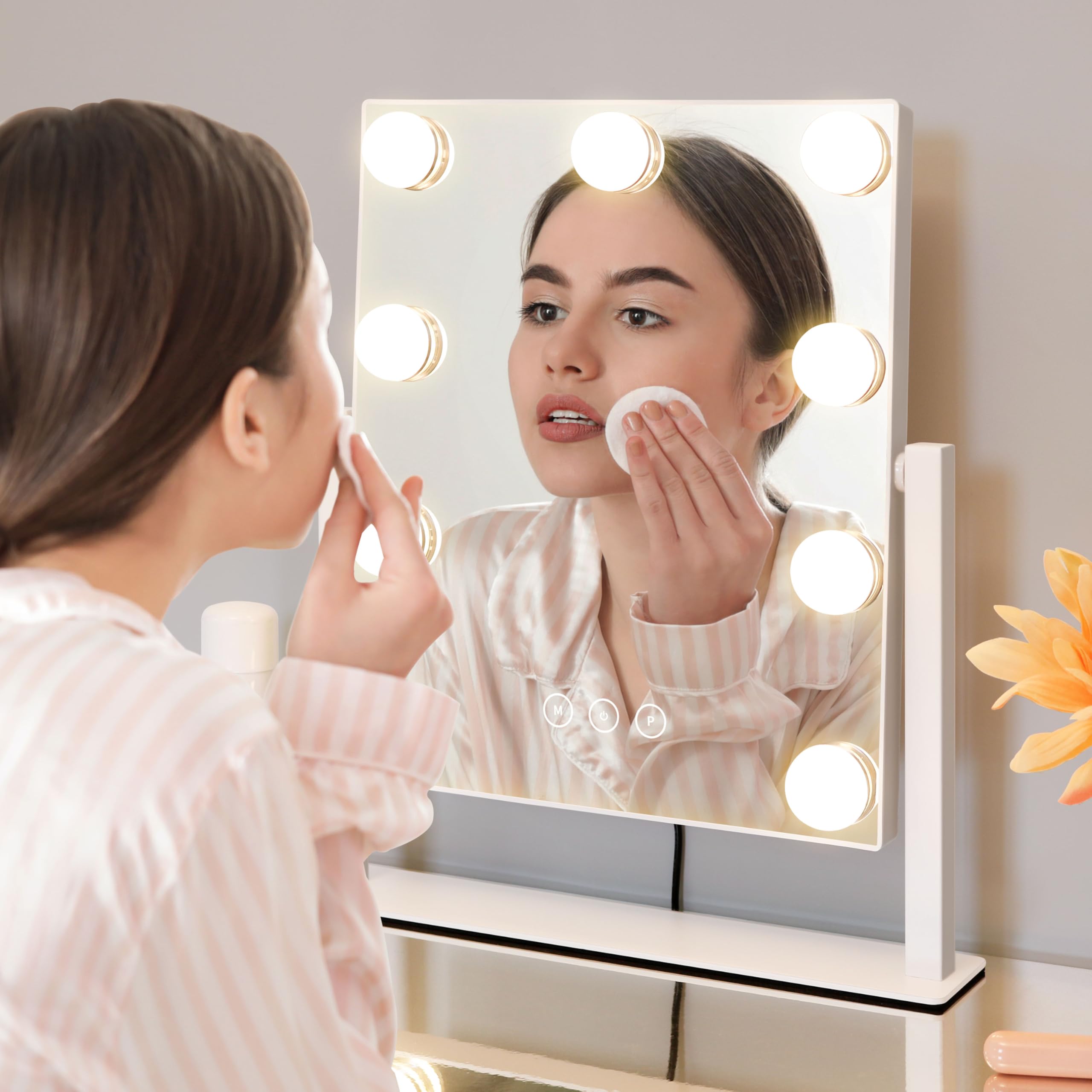 Kotdning vanity mirror highlighting nine frosted bulbs for even illumination