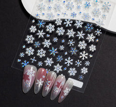 KRTBKR 5D embossed snowflakes detail on nails for holiday sparkle.