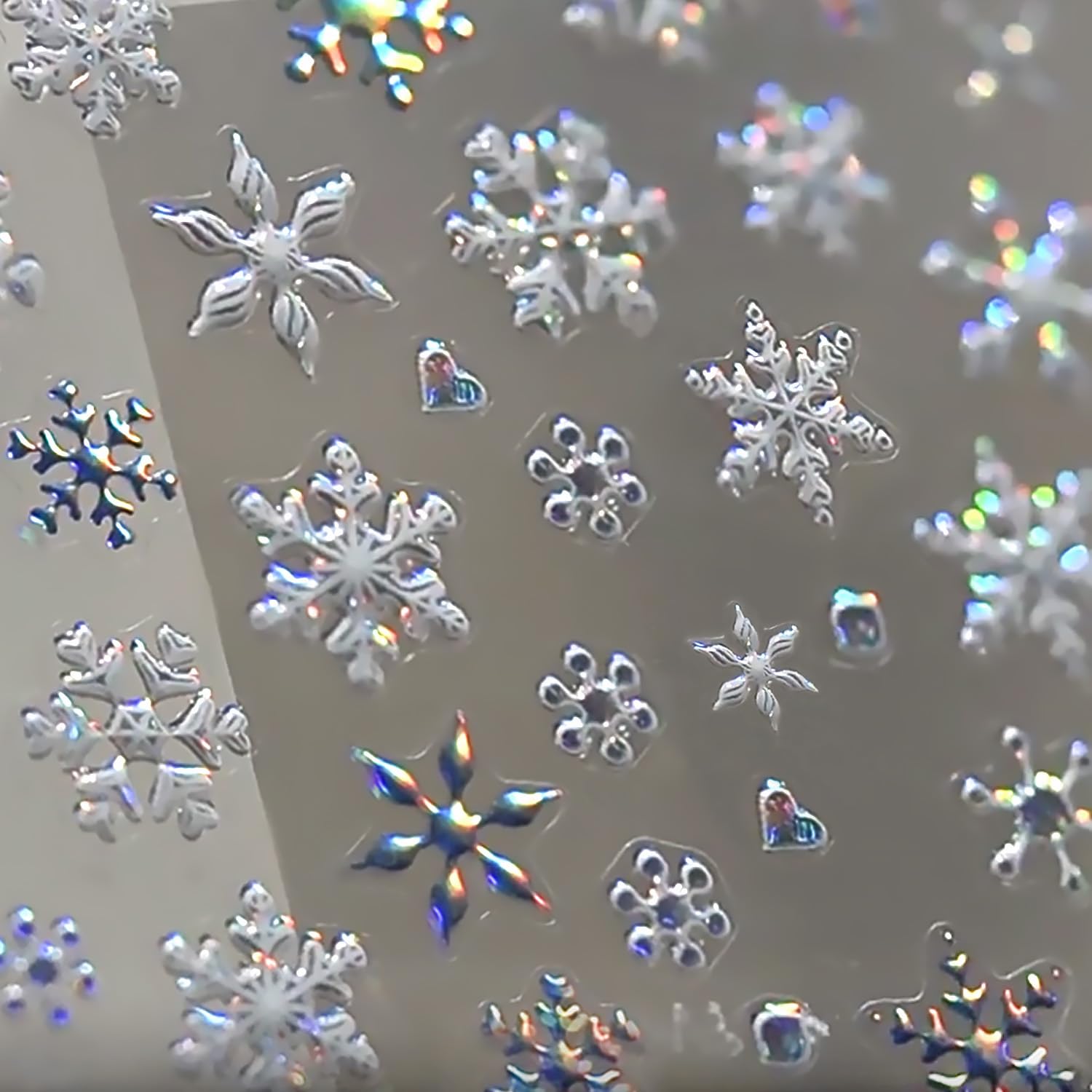 KRTBKR snowflake nail stickers sheet closeup for festive 5D embossed designs on nails.