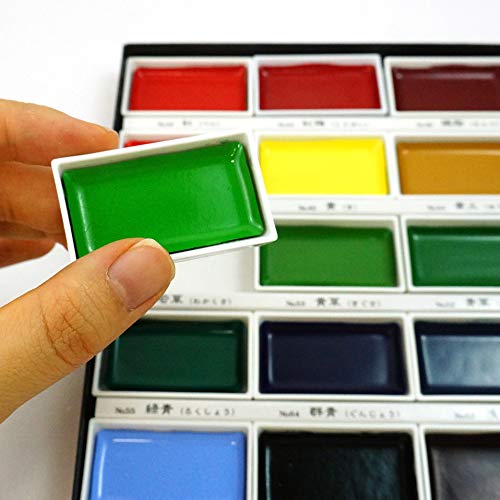 Kuretake Gansai Tambi palette sheet doubles as a portable color-mixer for swatches.