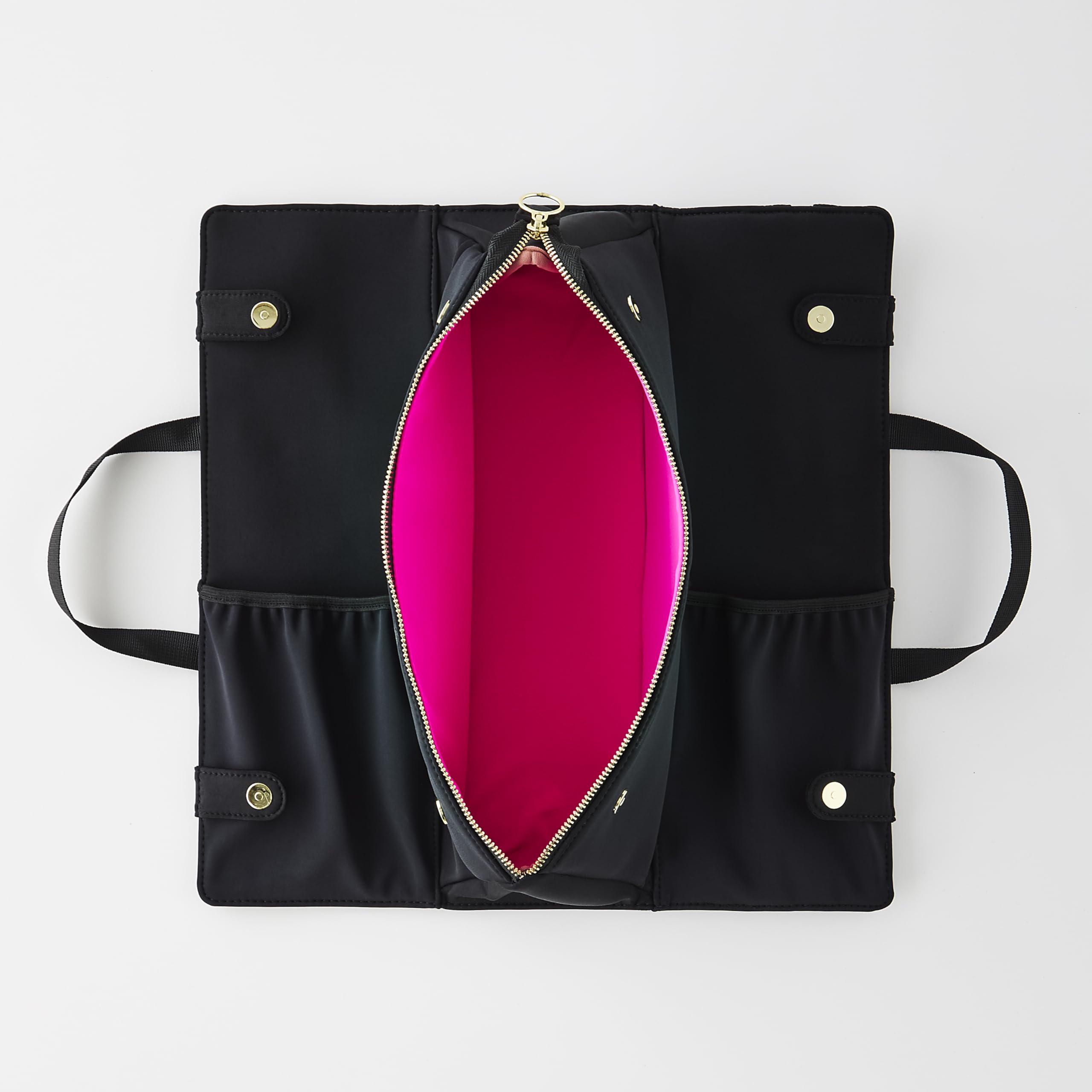 KUSSHI elasticized pockets secure brushes and accessories for easy access.