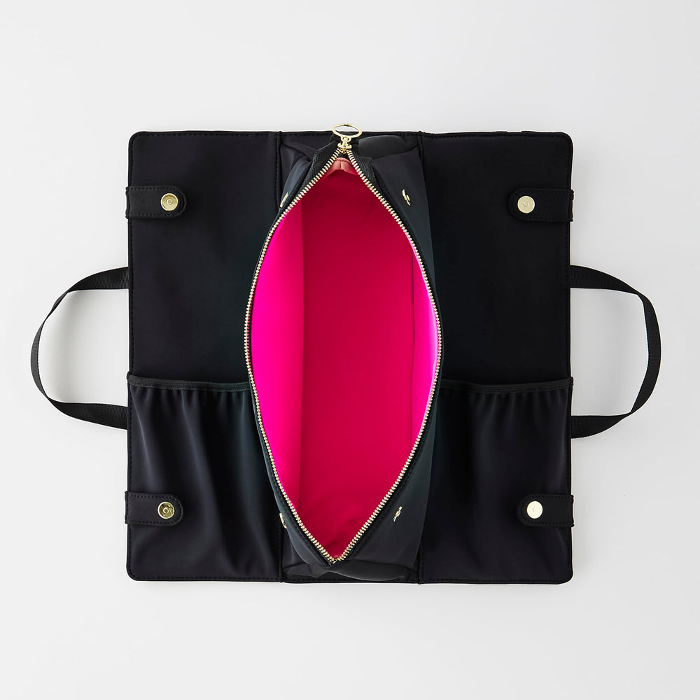 KUSSHI elasticized pockets secure brushes and accessories for easy access.