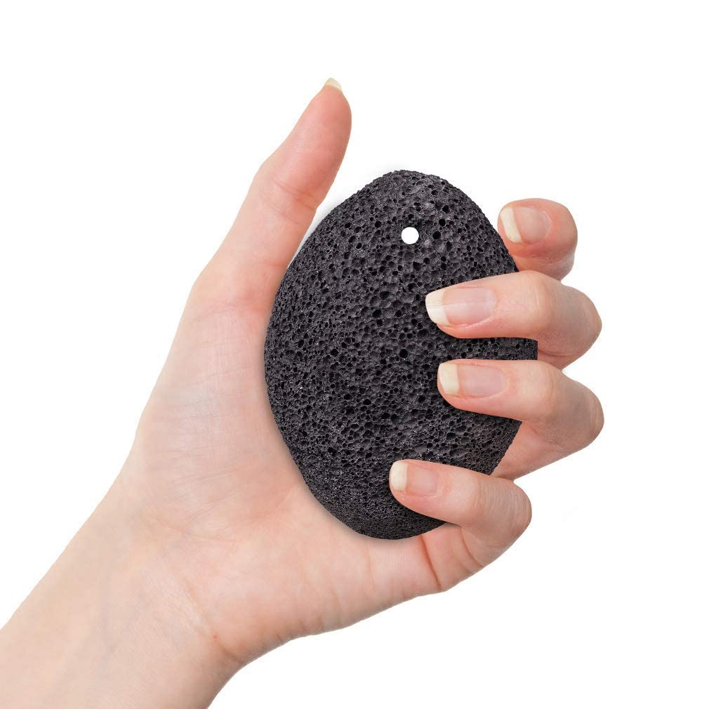 KuuCare compact pumice stone resting in hand for easy grip