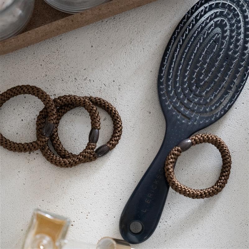L. Erickson hair ties feature a dark brown bead detail for a polished touch.
