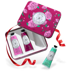La Chatelaine gift set front packaging with travel tins for on-the-go moisture.