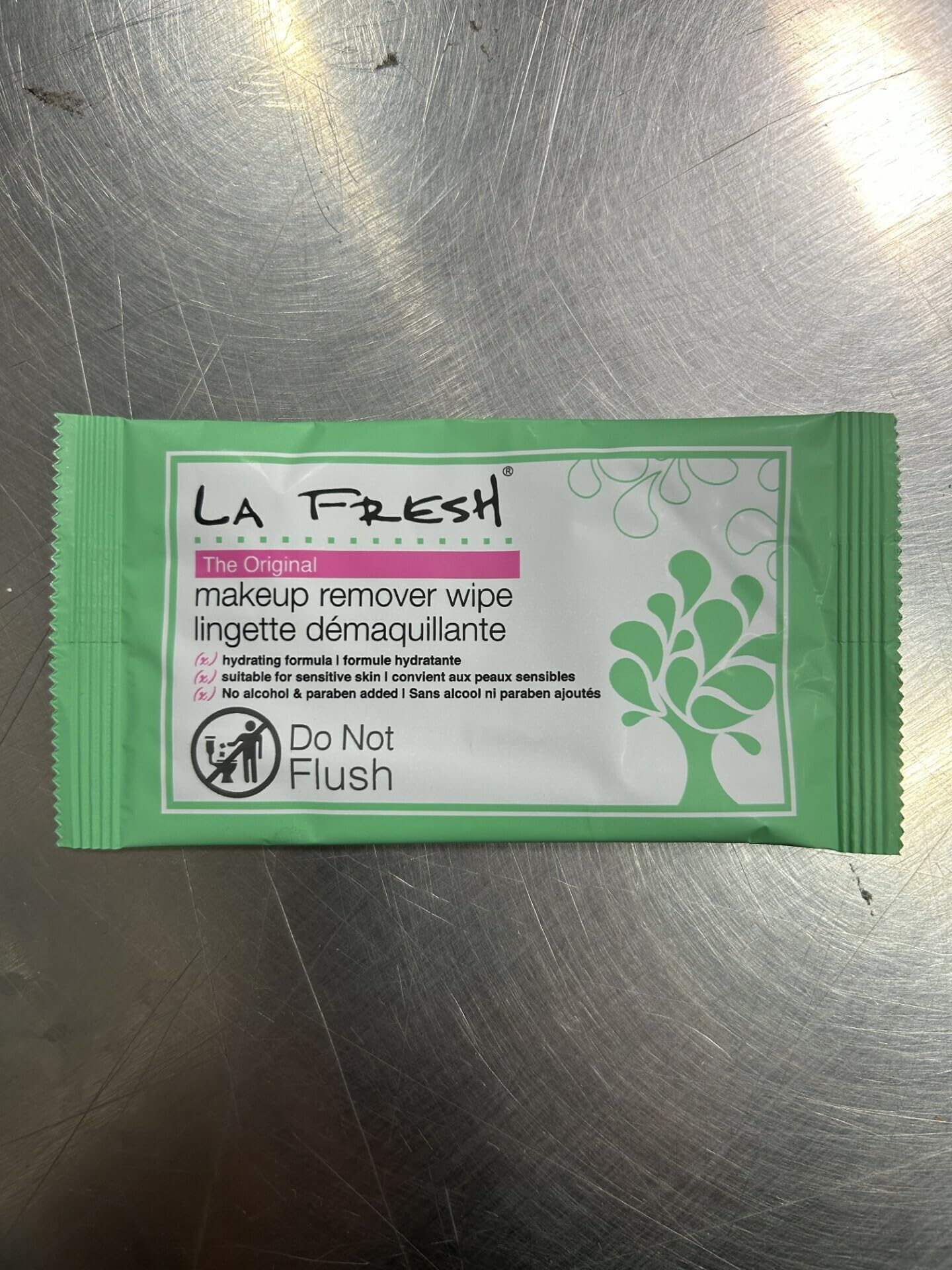 La Fresh makeup remover wipes close-up showing porcelain skin and gentle cleansing.