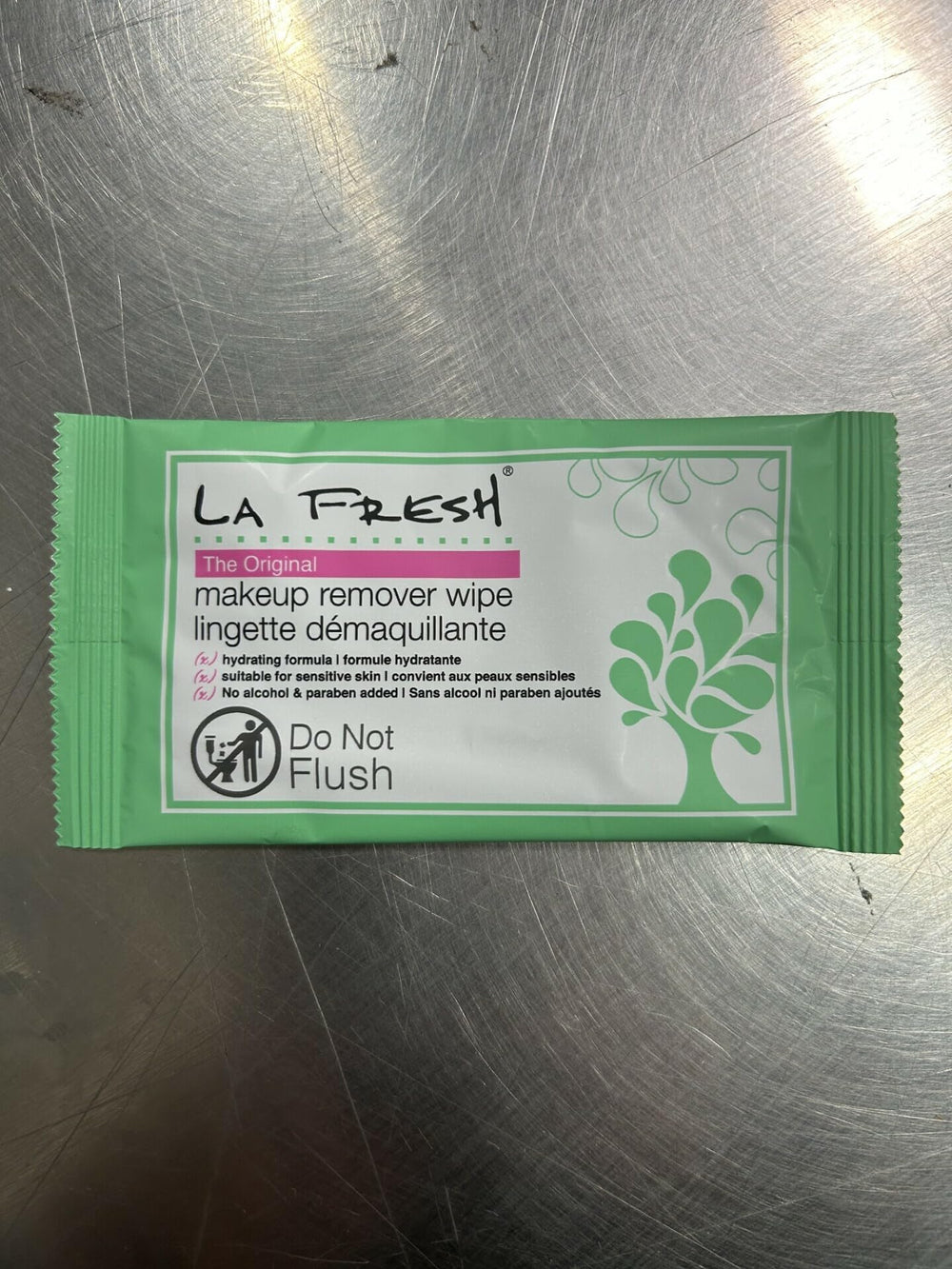 La Fresh makeup remover wipes close-up showing porcelain skin and gentle cleansing.