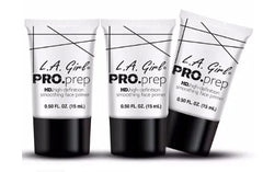 L.A. Girl primer application on hand showing smooth base preparation.