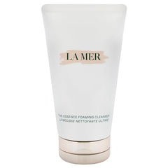 La Mer The Essence Foaming Cleanser cap close-up highlights premium packaging and gentle cleansing.