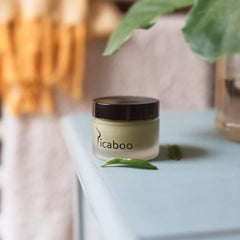 La Parea Wellness Picaboo Balm being applied to under-breast skin for soothing relief.