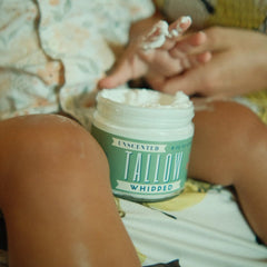 Lady May Tallow unscented moisturizer on skin for face and body.