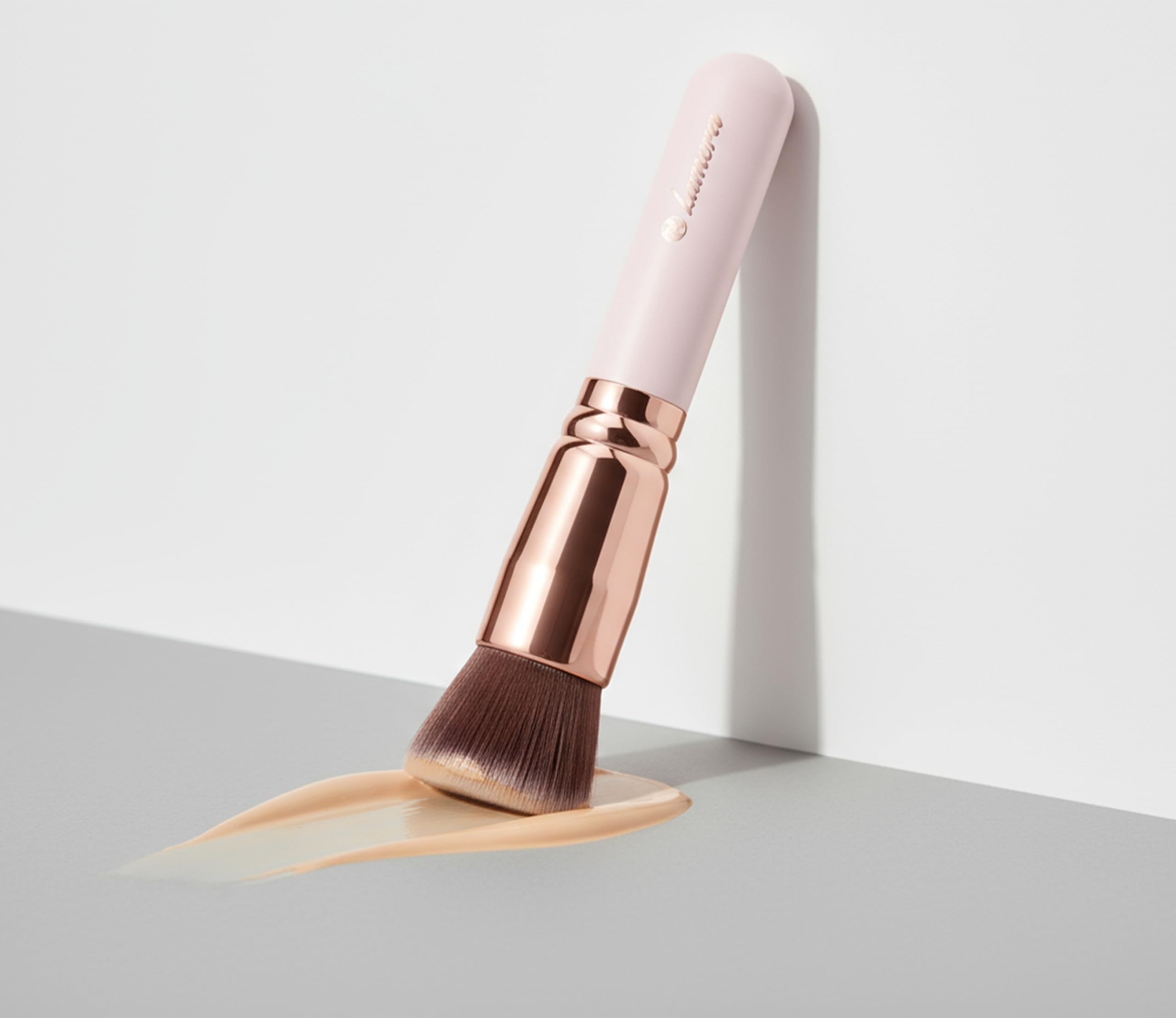 Lamora contour brush defines cheekbones with precise edge control.
