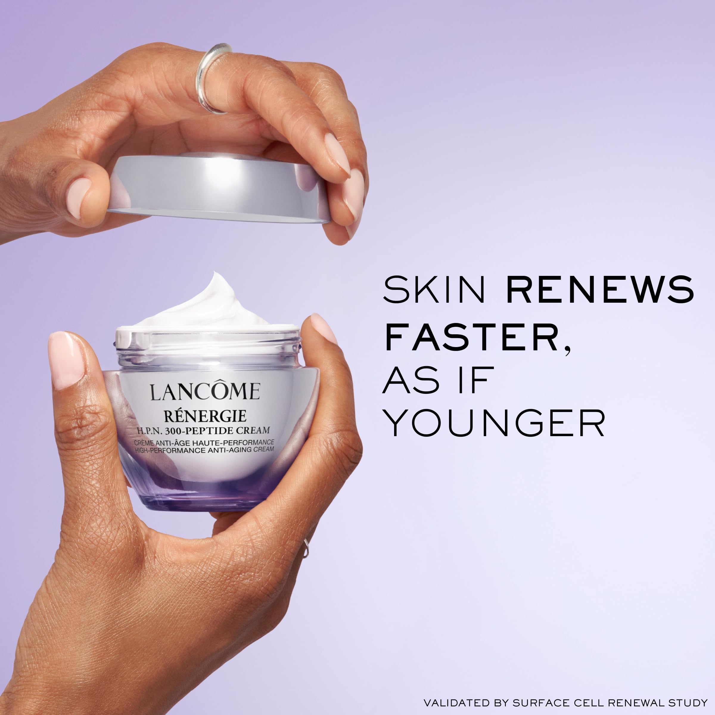Lancôme anti-aging cream on the face during routine for daily care.