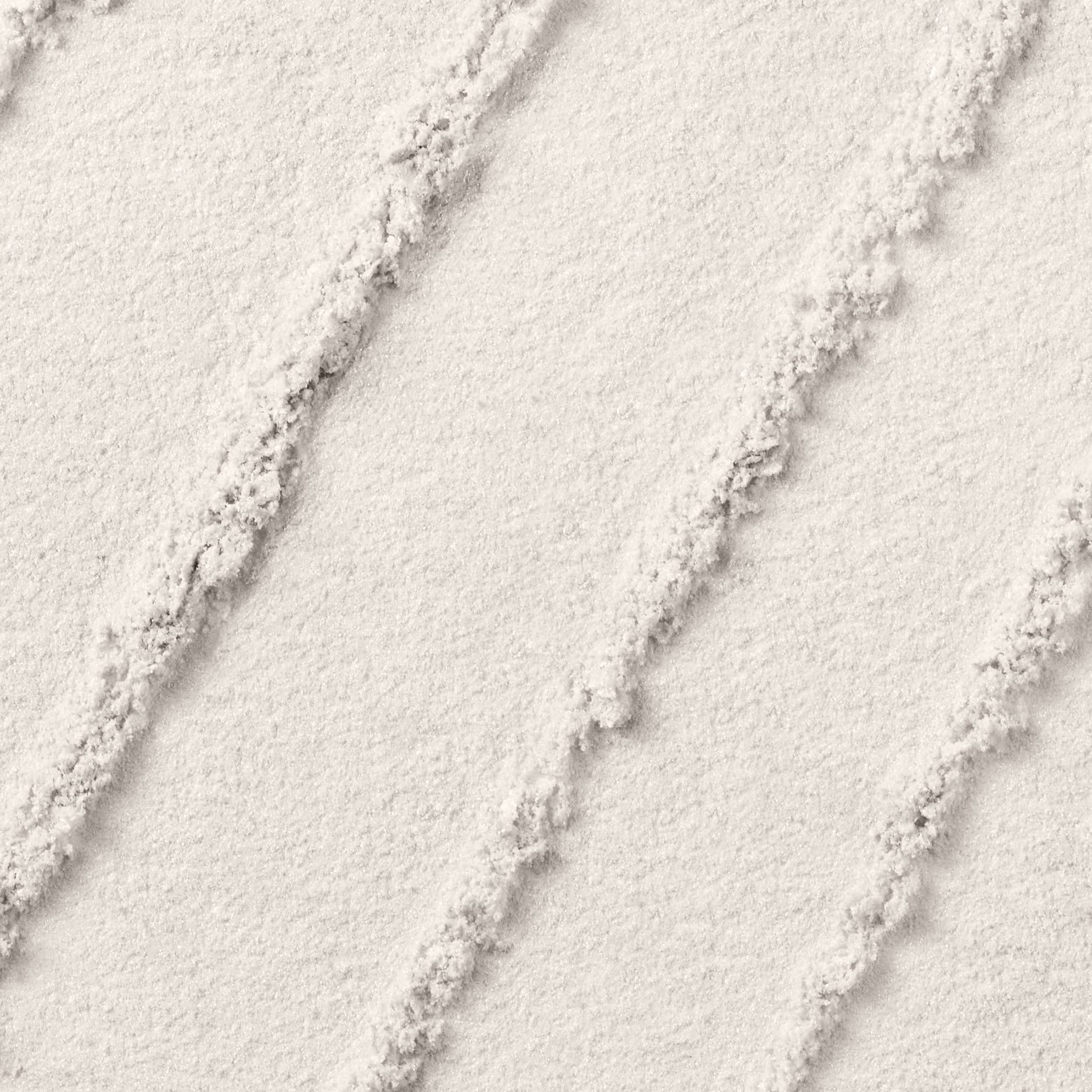 Lancôme Color Design swatch on skin demonstrates crease-resistant wear and vibrant color.