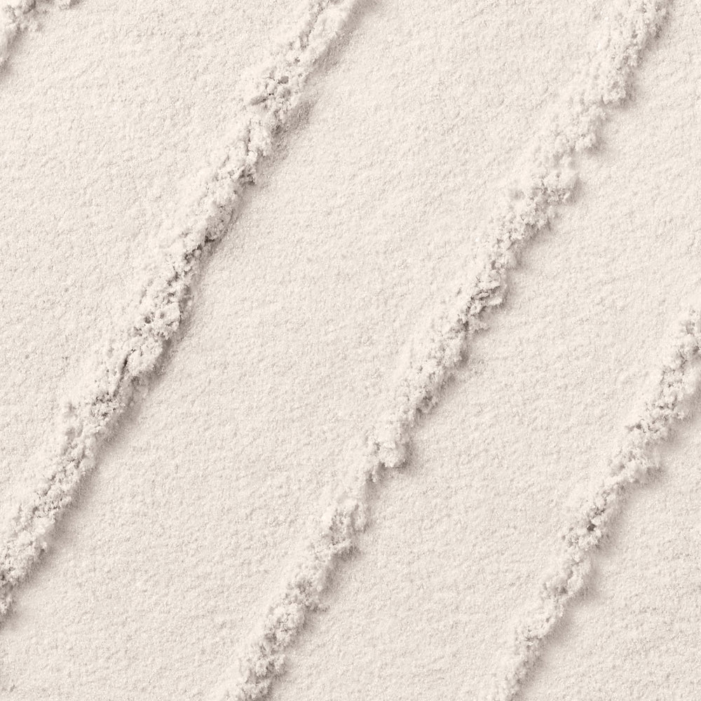 Lancôme Color Design swatch on skin demonstrates crease-resistant wear and vibrant color.