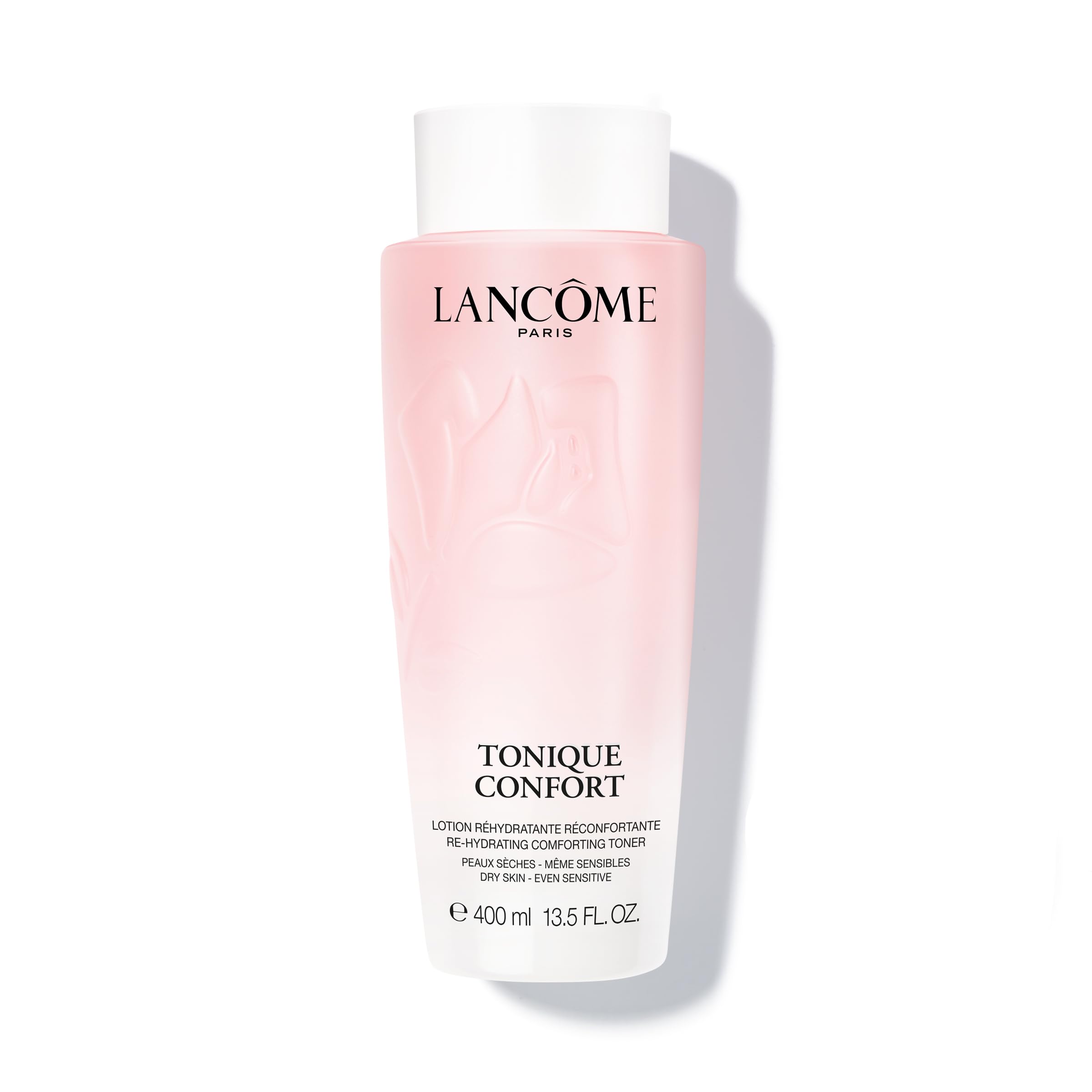 Lancôme Tonique Confort bottle close-up highlighting hydrating milky texture for radiant skin.