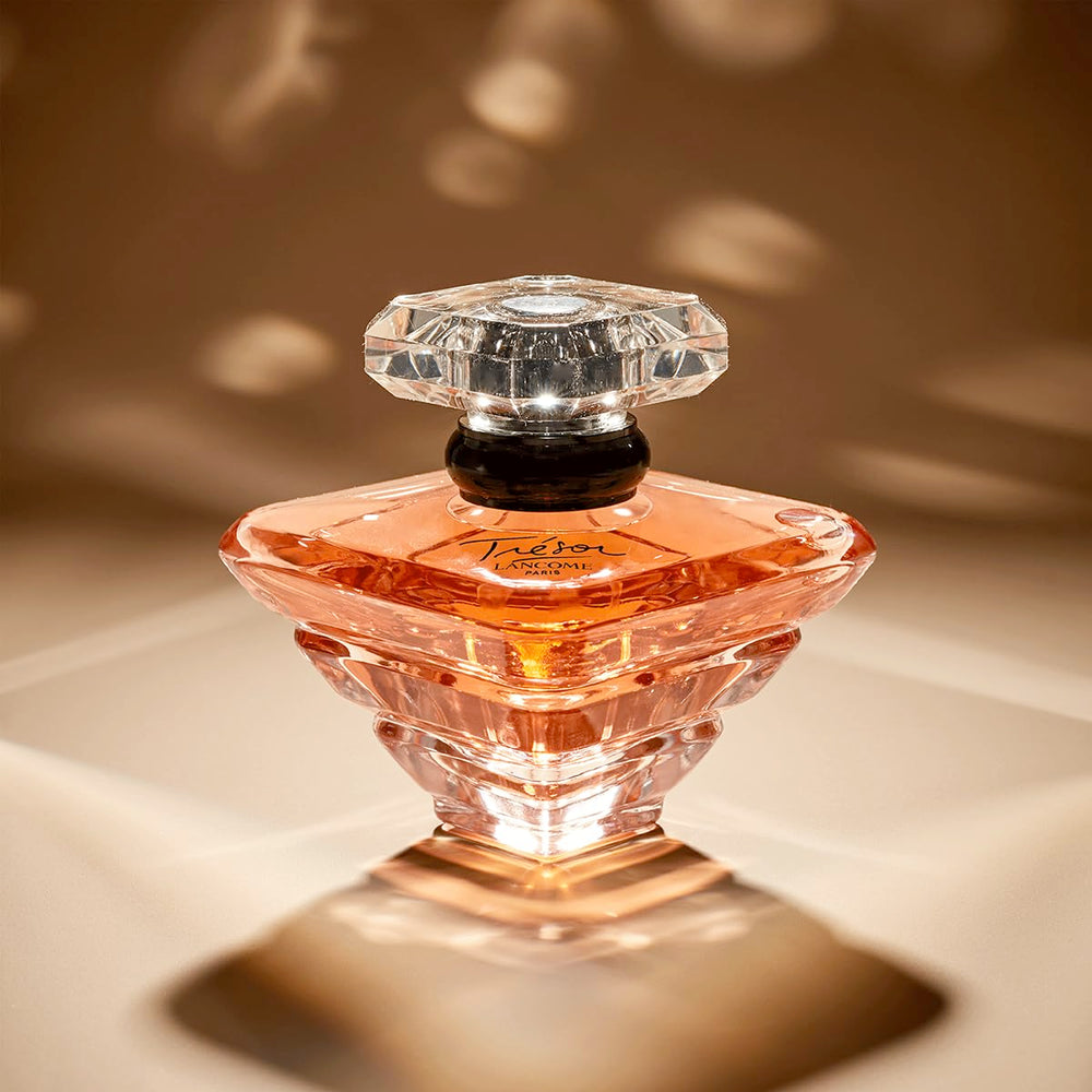 Lancôme Trésor application on wrist for long-lasting scent awareness.