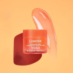 Laneige Lip Sleeping Mask Peach Iced Tea on lips for morning softness.