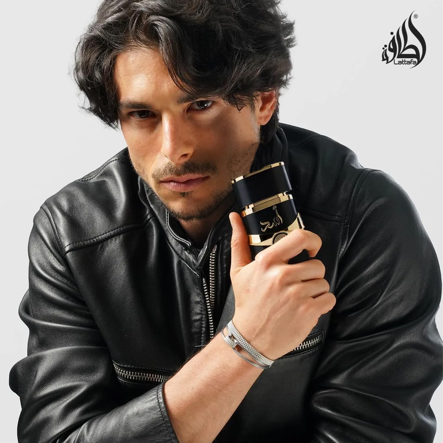 Lattafa Asad base notes image captures amber, vanilla, dry woods for a smooth foundation.
