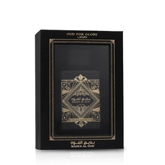Lattafa Bade'e Al Oud amber-wood tone close-up suggests luxurious fragrance layering.